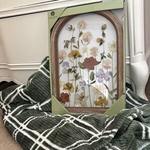 Charming Faux Floral Arch with Multicolor Blooms and Green Plaid Throw Blanket